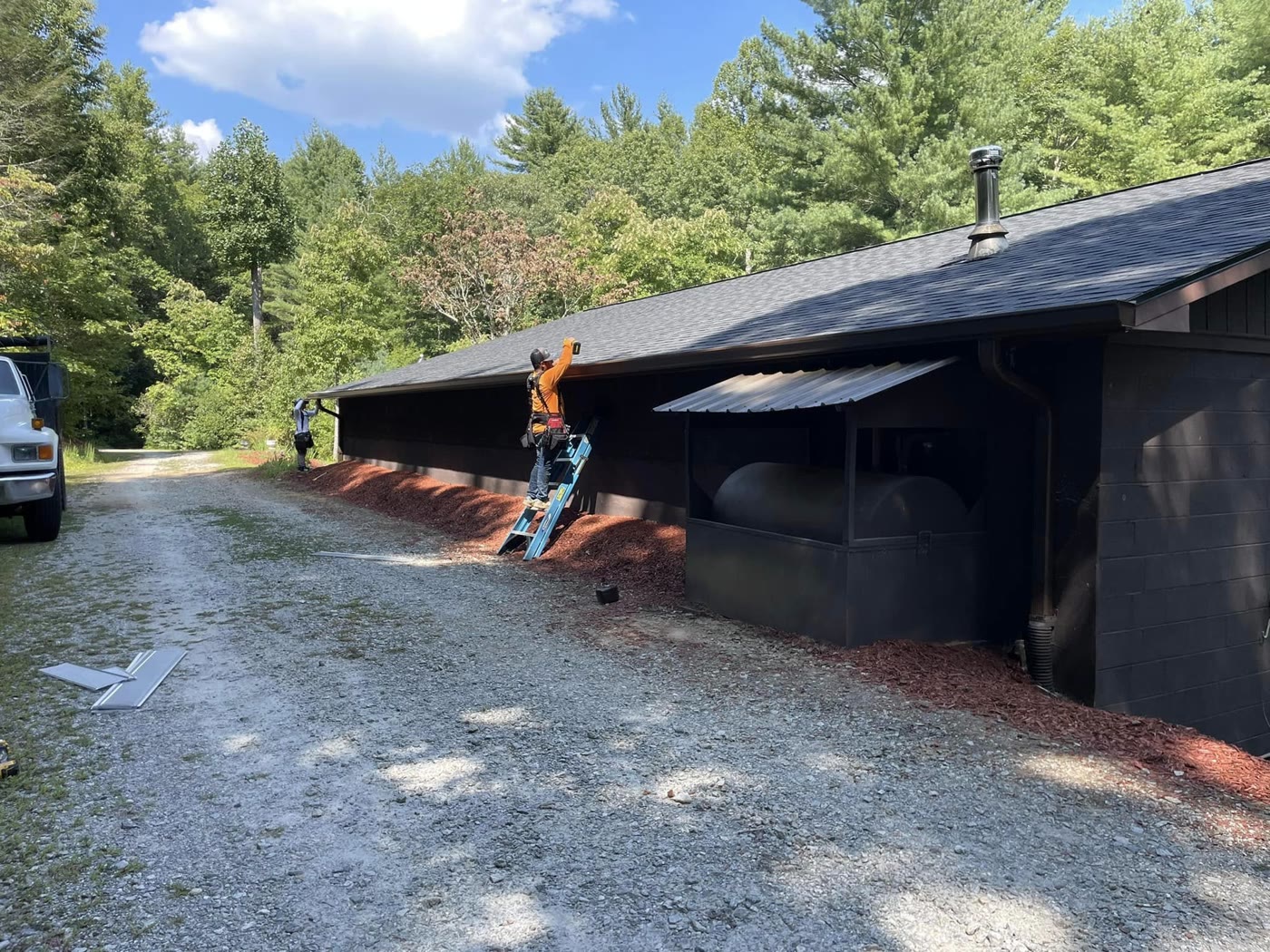 A RuFR USA crew installing new gutters on a Western North Carolina building