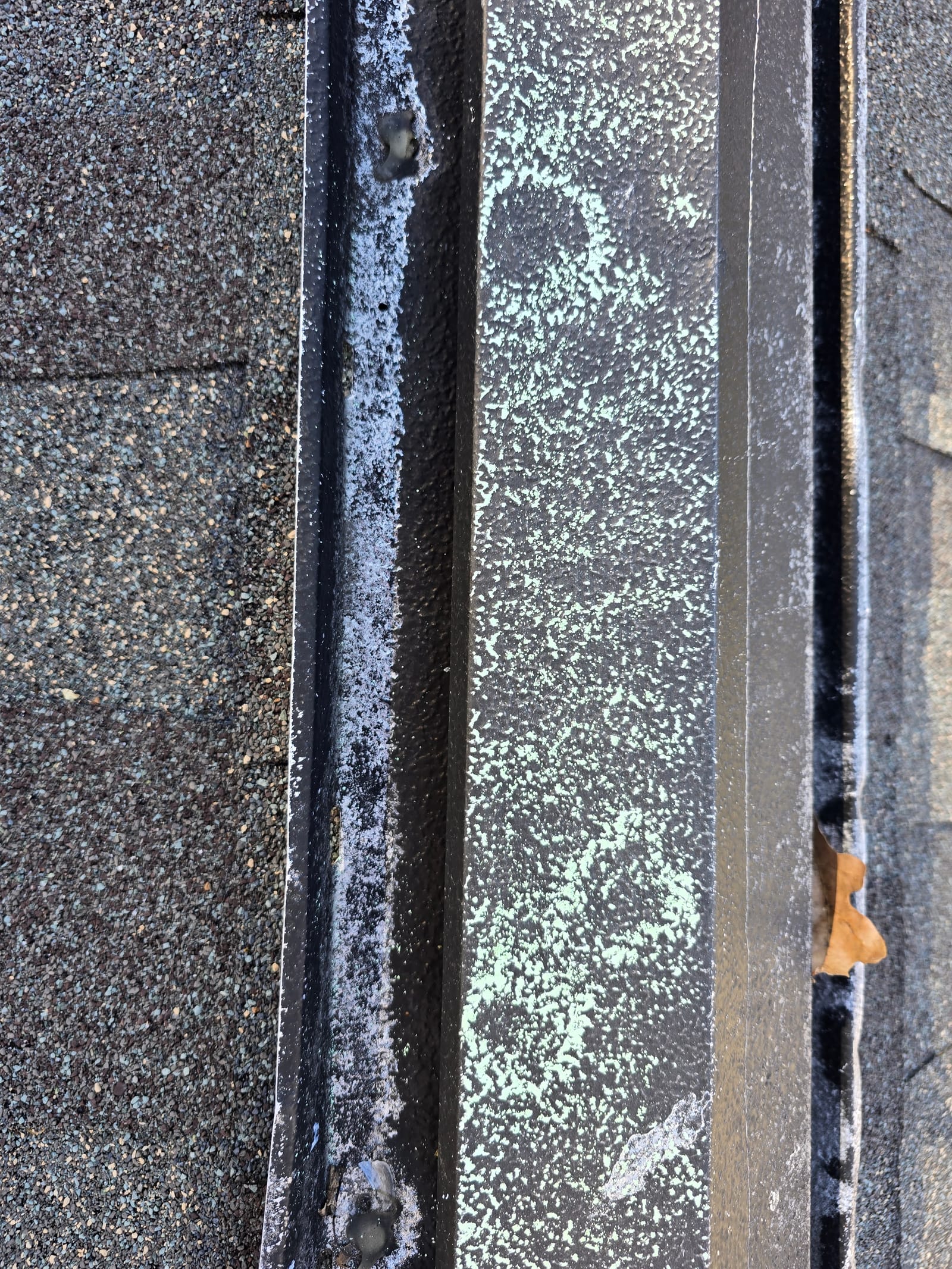 Hail impact damage on a roof ridge vent